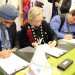 Minister of National Defence Harjit Sajjan (left), Minister of Indigenous and Northern Affairs Dr. Carolyn Bennett and Kettle and Stony Point Chief Tom Bressette sign the final Ipperwash settlement