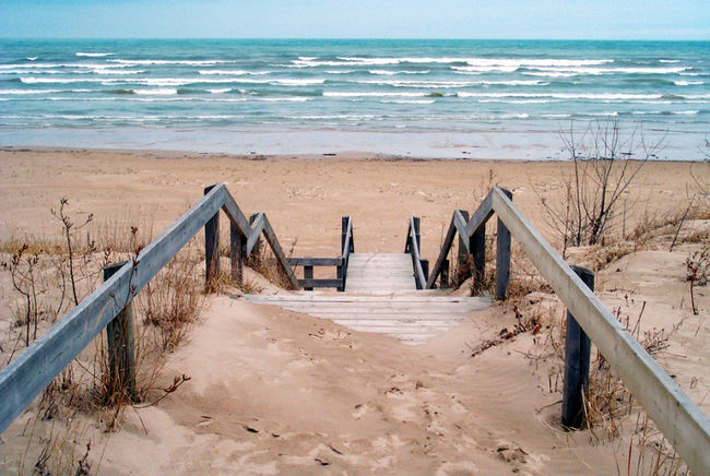 Sand covered steps to the waters edge
